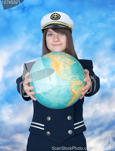 Image of Girl in sea uniform and globe