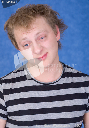 Image of Young man with dishevelled hair