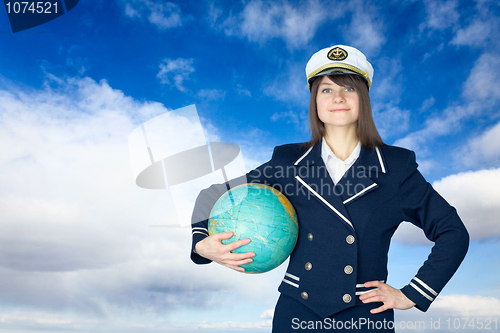 Image of Girl in sea uniform and globe