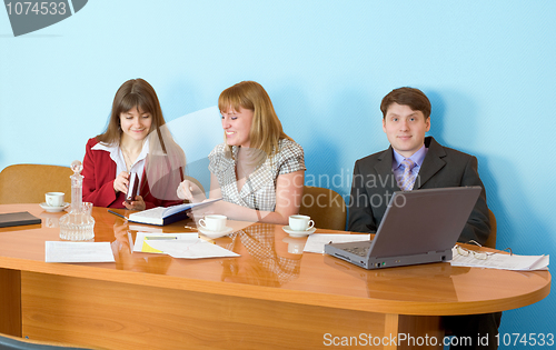 Image of Business team sits at the table