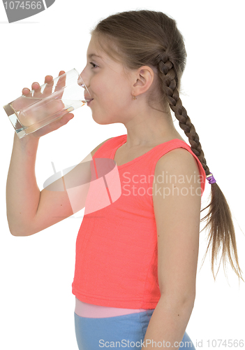 Image of Girl drinks water from a glass