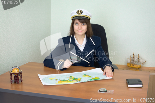 Image of Girl in the form of sea captain at office