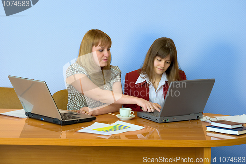 Image of Girls work sitting at a table