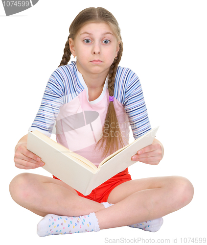 Image of Surprised girl with the book in hands