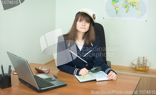 Image of Girl - the sea captain with a atlas