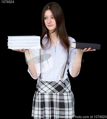 Image of Girl with books on hands on a black