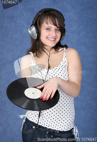 Image of Young woman in earphones