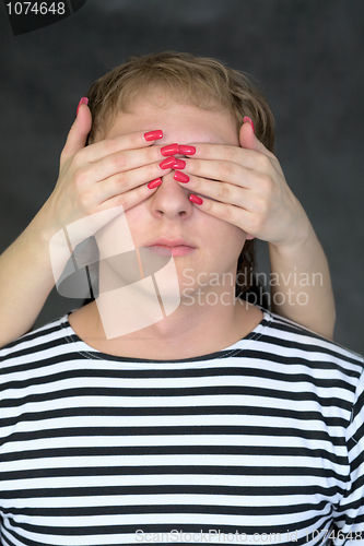 Image of Hands have closed to the man of an eye