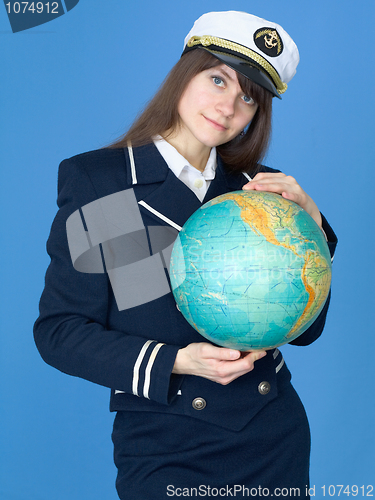 Image of Woman in sea uniform and globe