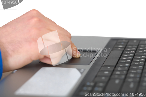 Image of Male hand on laptop