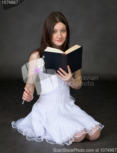 Image of Girl with the book and a magic wand