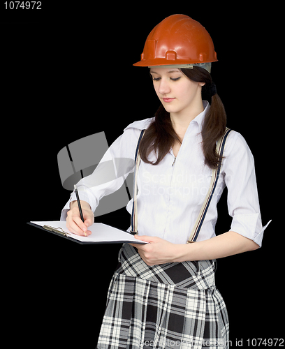 Image of Young woman in a helmet with a tablet