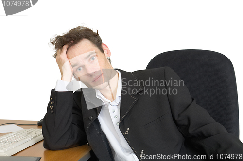 Image of Sorrowful businessman on a workplace