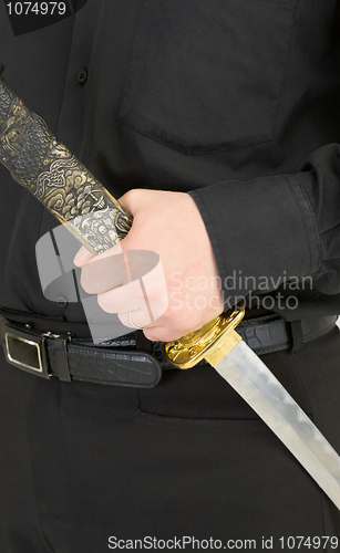 Image of Sword in male hand