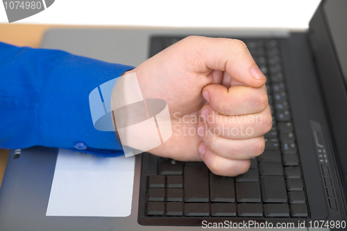 Image of Fist on the laptop
