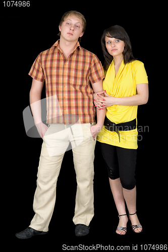 Image of Serious guy and the girl on a black