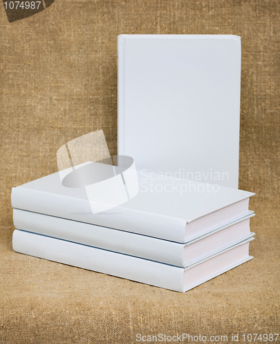 Image of White books on the textile background