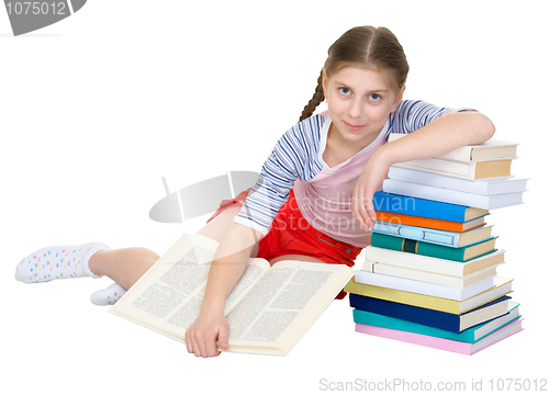 Image of Girl sits having leant the elbows on a books