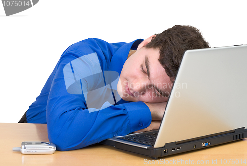 Image of Young man sleeping from laptop