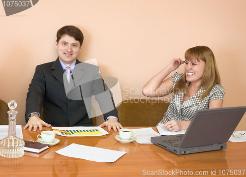 Image of Business people sits at the table