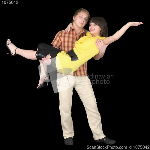 Image of Young man holds the girlfriend on hands