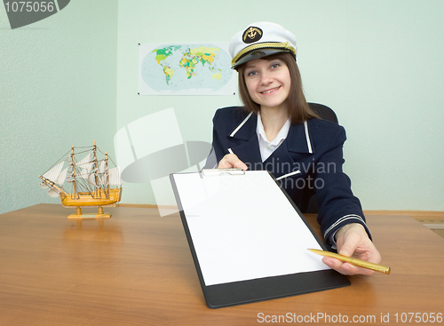 Image of Girl in a sea uniform at office with tablet