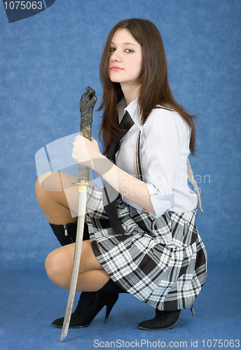 Image of Girl with sword sit on a blue background