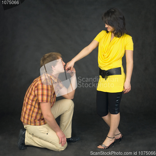 Image of Man kisses a hand to the woman