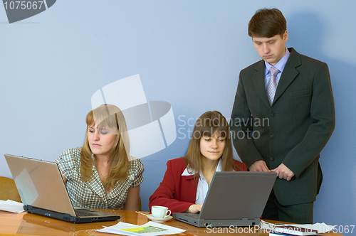 Image of Girls at a desktop and their chief