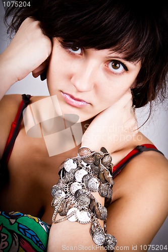 Image of brunette lady with bracelets