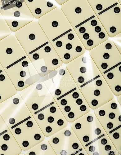 Image of Background from dominoes with white rays