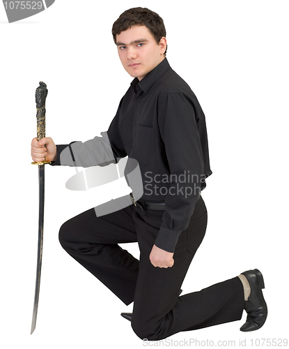 Image of Man in black with the japanese sword in a hand