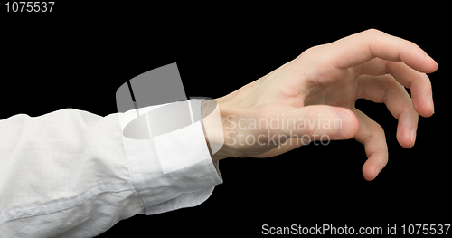 Image of Greedy hand with crooked fingers on a black