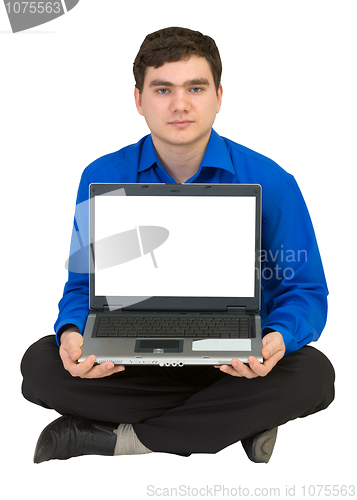 Image of Guy sits on a floor with the laptop