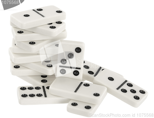 Image of Heap of bones of dominoes on a white