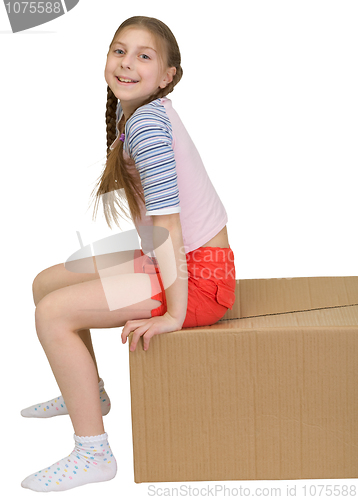Image of Girl sit on cardboard box