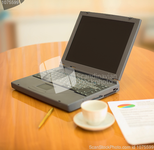 Image of Laptop on a table at office