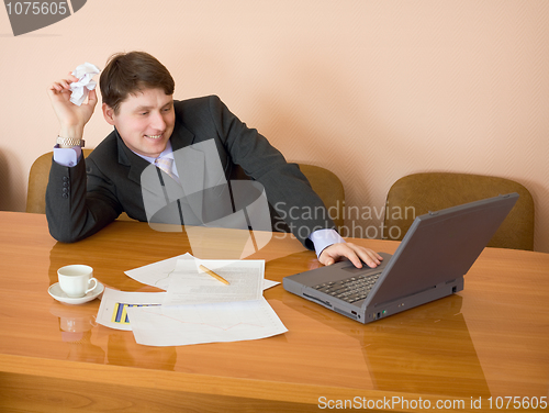 Image of Businessman on a workplace with the laptop