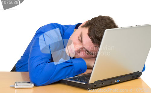 Image of Young man sleeps with the laptop