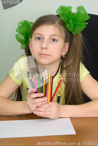 Image of Girl with color pencils in hands