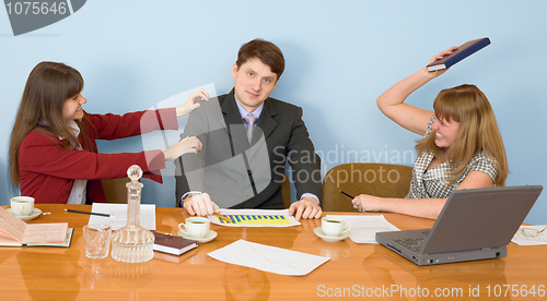 Image of Business team sits at the table