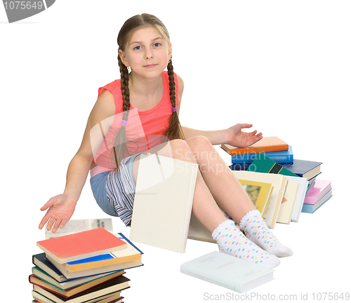 Image of Schoolgirl among a heap of books