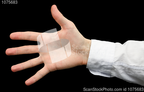 Image of Hand with a white sleeve on  black