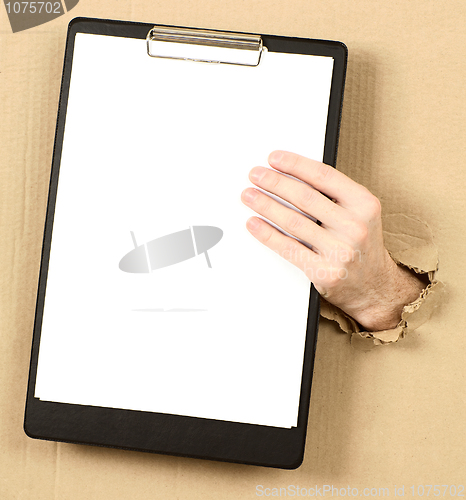 Image of Mans hand holds tablet