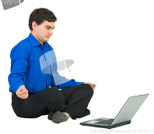 Image of Man in a lotus pose with the laptop