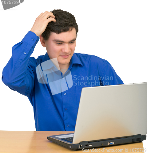 Image of Young man with the laptop isolated on  white