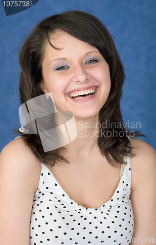 Image of Laughing, happy girl on a blue background