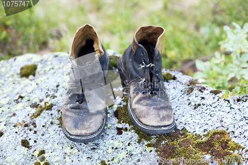 Image of Old leather brown dirty boots