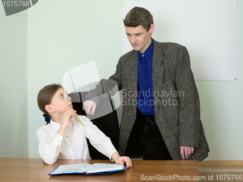 Image of Teacher and schoolgirl with book