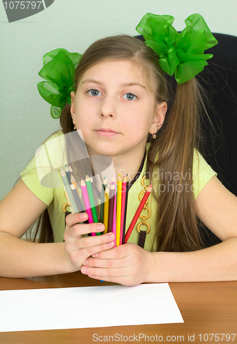 Image of Girl with color pencils in hands